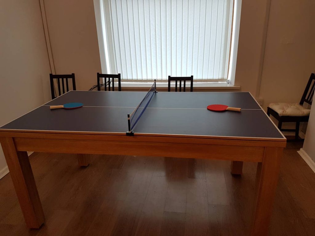 The dining table turns into a table tennis table